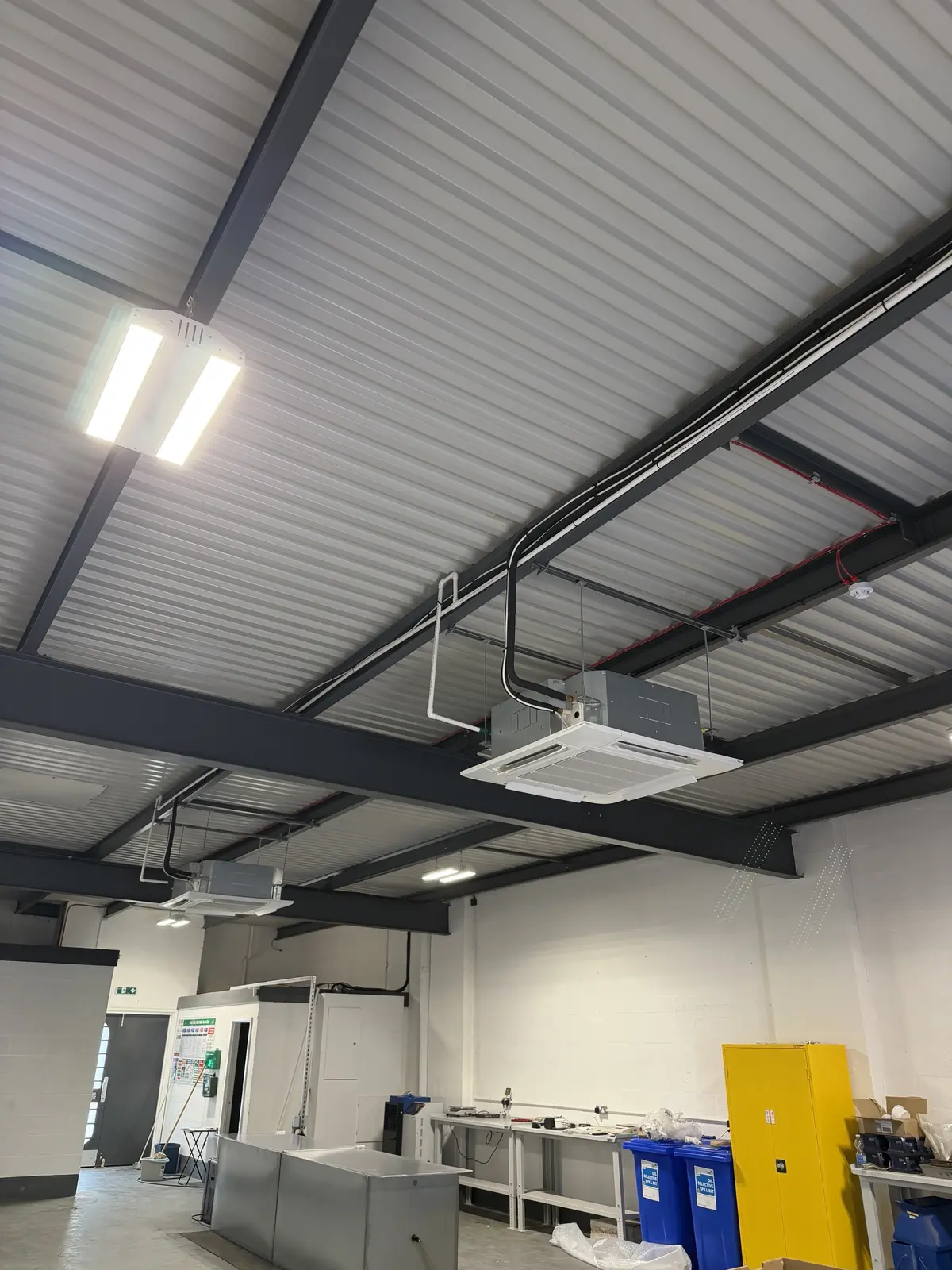Ceiling cassette air conditioning installed in a commercial workshop