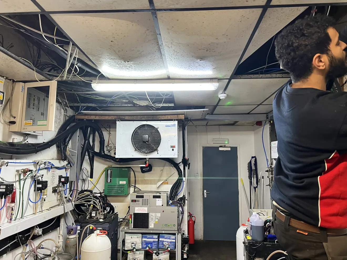 Engineer working on cellar cooling and drinks refrigeration