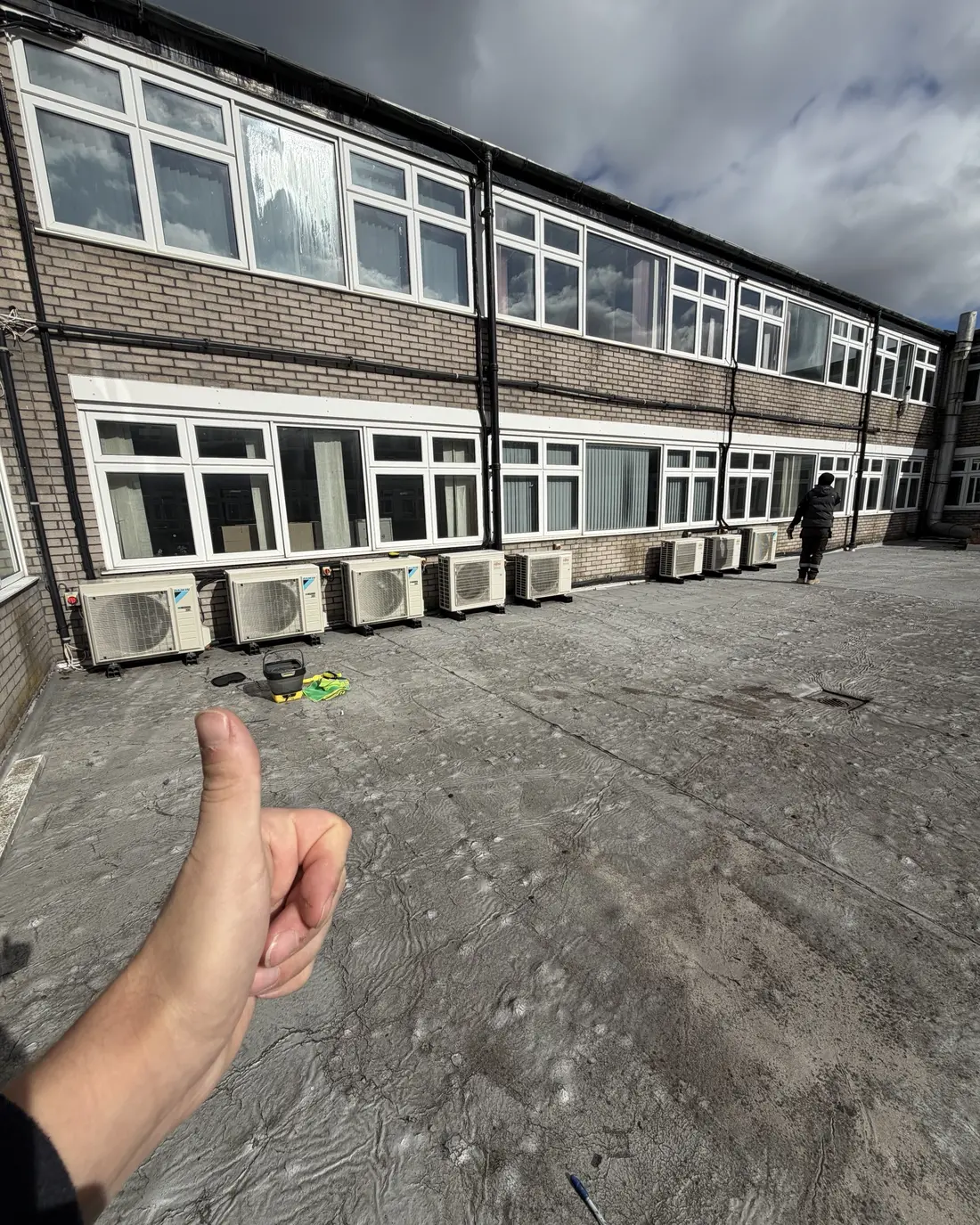 Eight commercial air conditioning condensers on one roof after planned maintenance