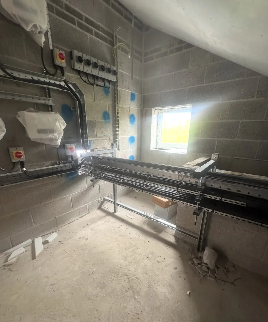 Steel cable tray, local isolators and pipework routed through a new plant room